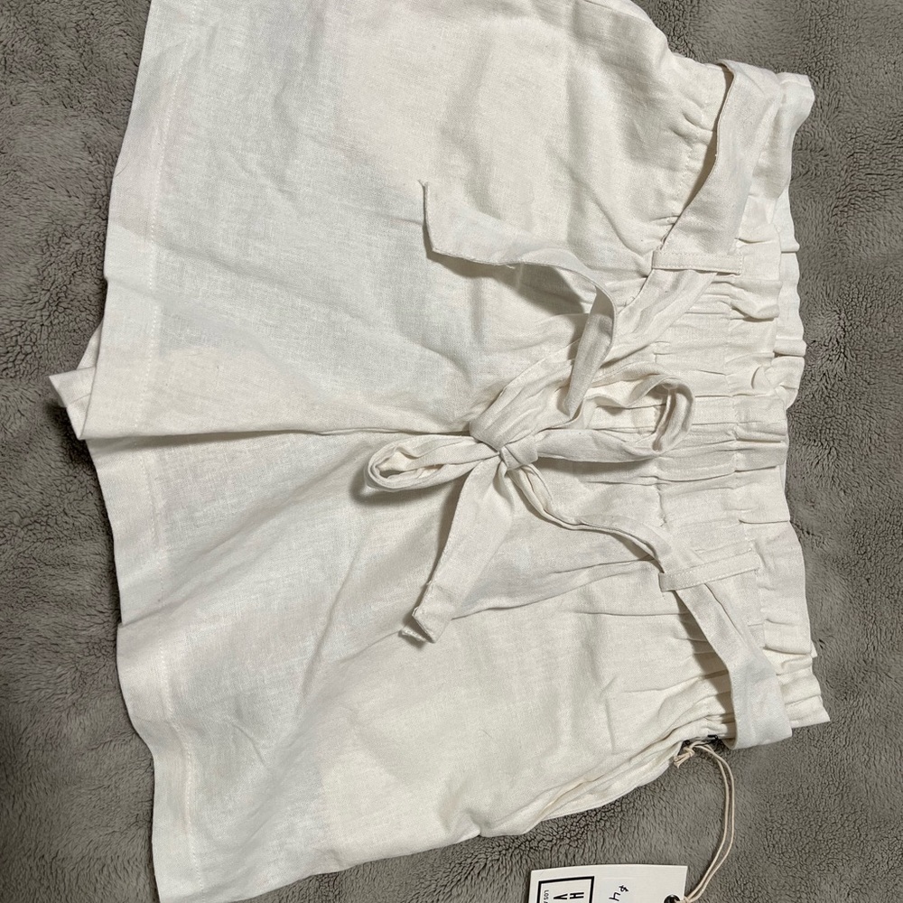 Have White High Waist Shorts with Ruffle Waist